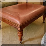 F23. Grange Furniture leather top ottoman. 18”h x 40”w x 29”d 